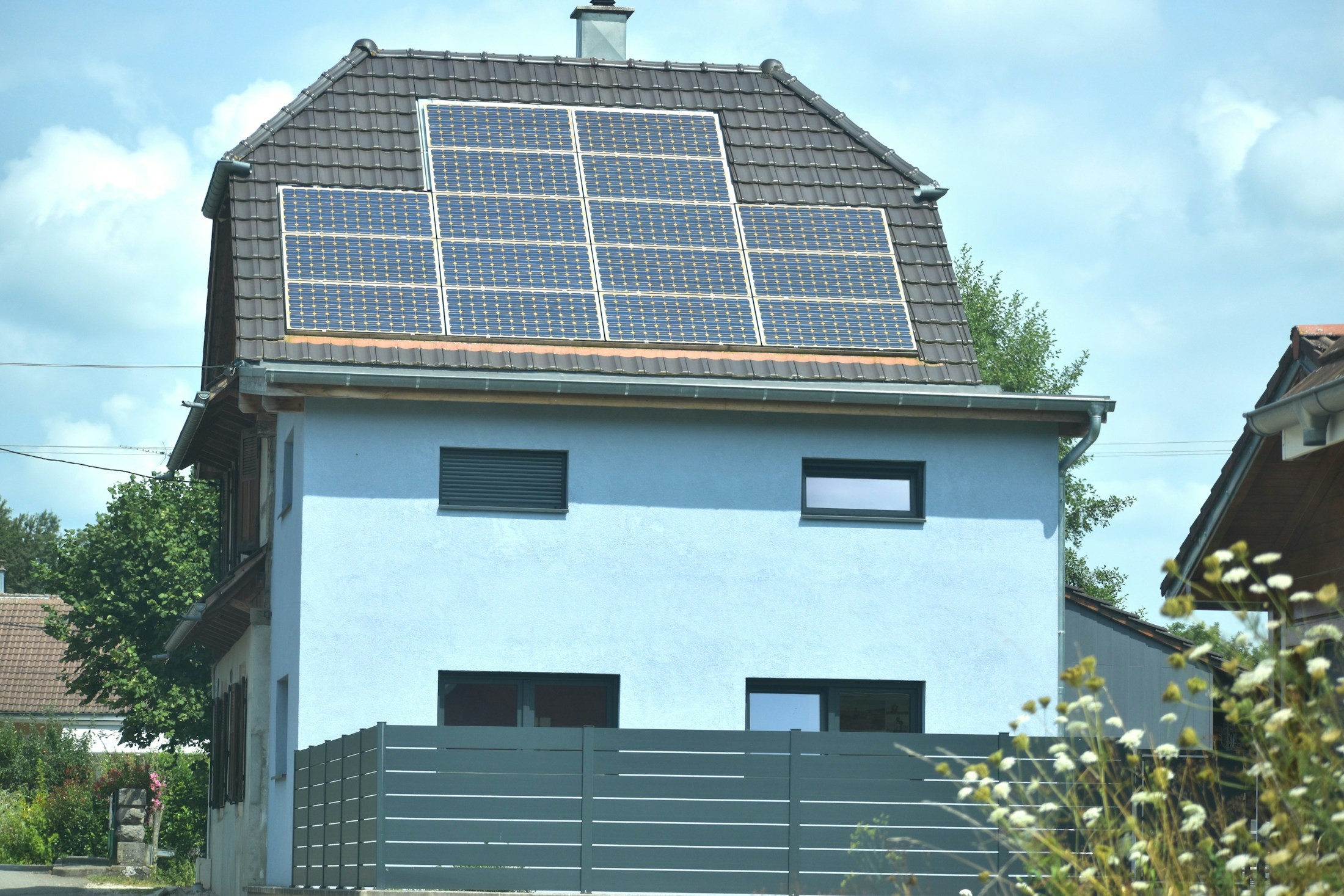 Illustrative home with rooftop solar panels